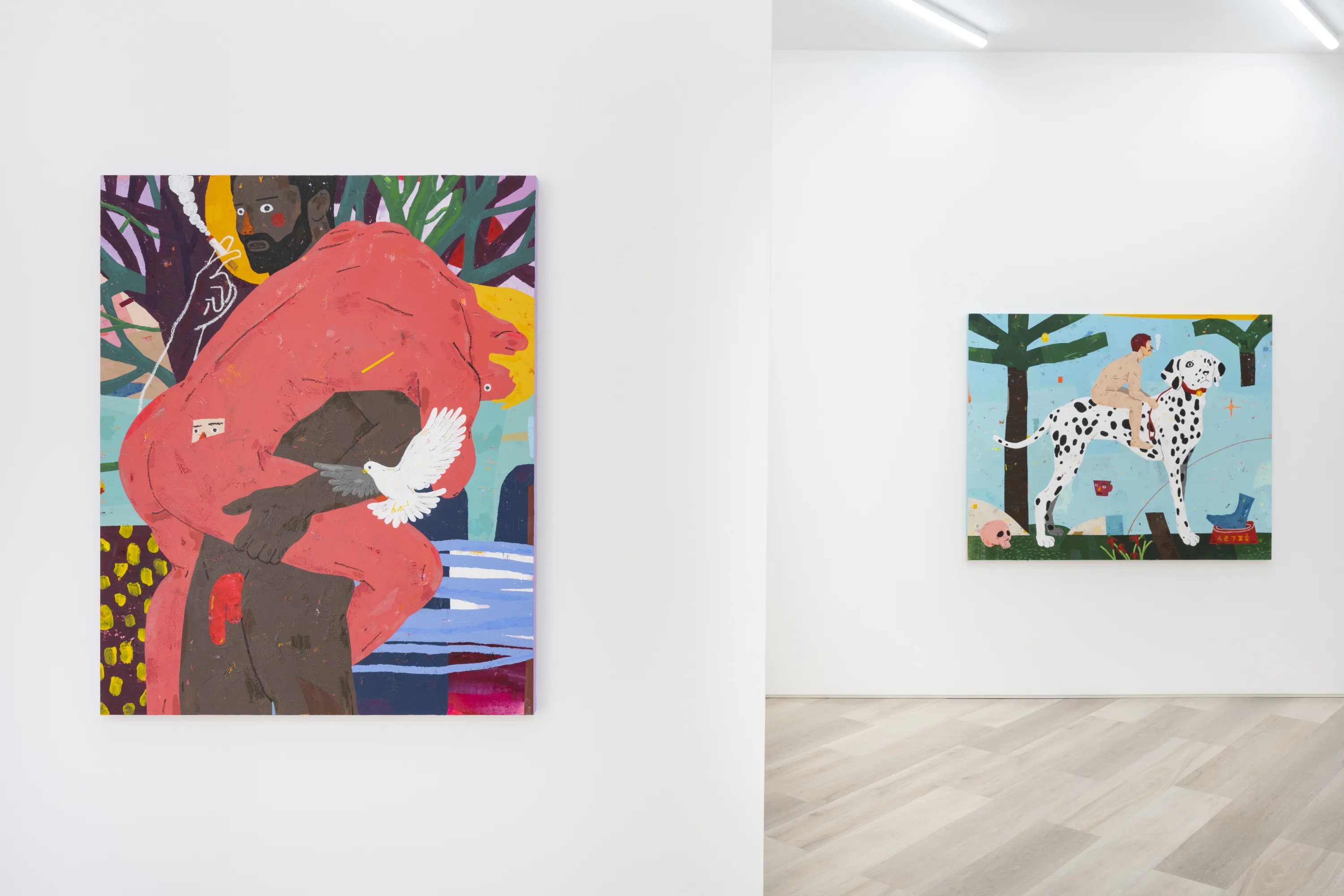 Colorful contemporary paintings displayed in a bright white art gallery space.